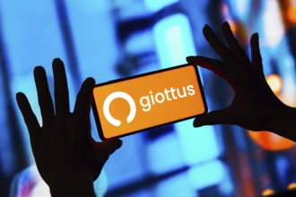 In this photo illustration, the Giottus logo seen displayed on a smartphone