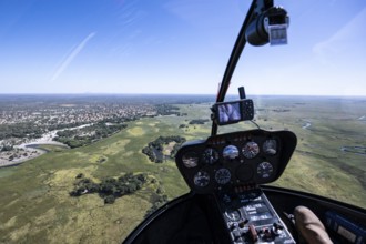 Okawango Delta Pfannenstil, Helicopter cockpit over the Okawango Delta, aerial view, Botswana,