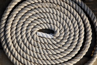 Coil of marine rope detail in marina port