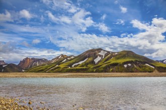 Cold water streams among yellow tundra. The magic of summer in Iceland