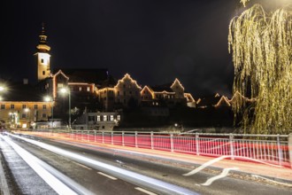 Bridge leads into the old town, Christmas illuminated house facade of Frohnleiten, night shot,