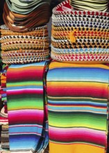 Mexican serape colorful stacked and charro hats mariachi
