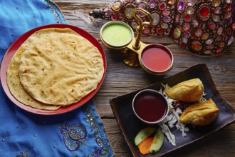 Samosa with Papadam indian recipe red and green sauces samoosa or sambusa