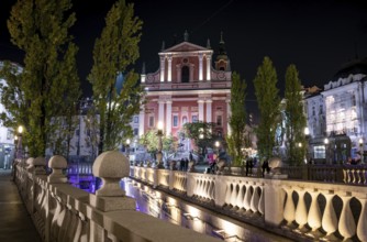 Famous Three Bridges and the Preseren square in the center of Ljubljana illuminated at night,