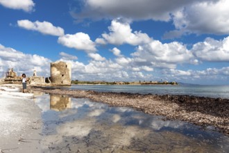 Scenic view of Saline tower against the scattered clouds at midday. Stintino, Sardinia. Italy