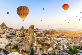 Hot air balloons over Goreme at sunrise, Cappadocia