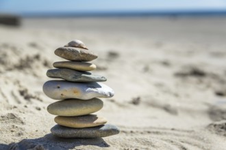 Round pebbles on the beach in Denmark is a symbol for balance. Stones on the beach in Denmark is a
