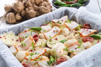 Jerusalem artichoke au gratin with ham and chili