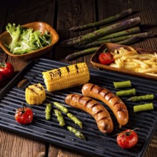 Grilled krakauer with french fries and green salad