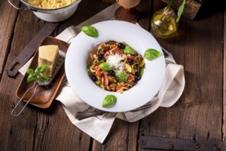 Ribbon Pasta with courgette and olives in tomato sauce