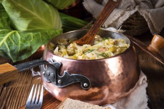 Young and fresh cabbage cooked with bacon cubes