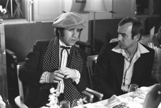 Elton John. English singer, songwriter born march 25 1947. Pictured wearing a chequered cap and a