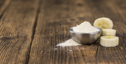 Banana Powder on rustic wooden background as close-up shot