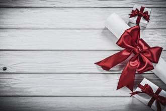 Paper roll with red ribbon present boxes holidays concept