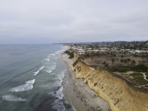 Aerial view of Del Mar North Beach, California coastal cliffs and House with Pacific ocean. San