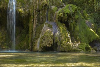 The tufa waterfall near Arbois. Crystal clear waterfall, powerful waterfall