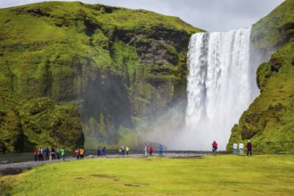 Magnificent famous waterfall Skógafoss, Iceland. A powerful jet Skógar river falls from a large