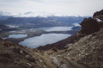 Rocky path with views of several lakes and valleys between the mountains, Roys Peak, Wanaka, New