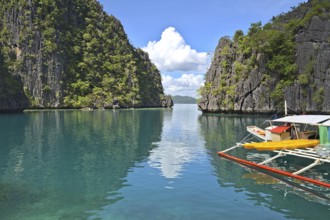 Coron Island Lagoon with a tourist boats at the pier