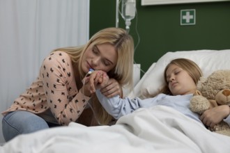 A heartfelt and nurturing moment shared between a caring mother and her daughter inside a hospital