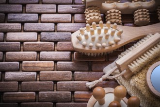 Wisp of bast loofah massagers and brush on textured wooden mat sauna concept