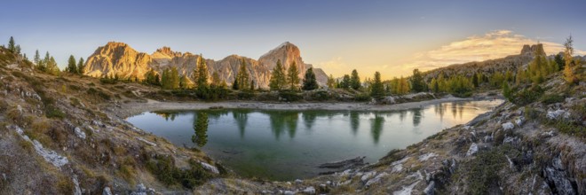 Panorama of the lake Lago di Limedes with the reflection of the surrounding mountains