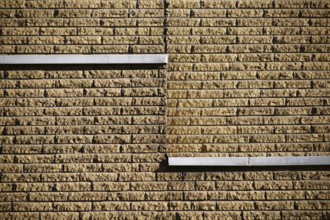 Close-up of a clinker brick façade made of rough stones on the façade of a building