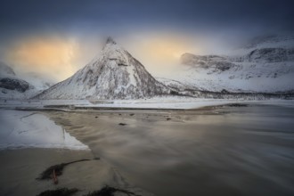 Beautiful winter landscape scene in Ersfjord and mountain in background in Northern Norway. sunset