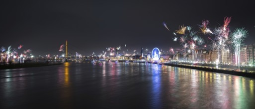 Panorama of City Düsseldorf at Silvester with fireworks and River Rhein