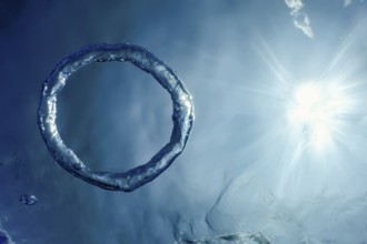 Bubble Ring Underwater ascends towards the Sun