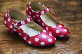 Red dance shoes with white dots