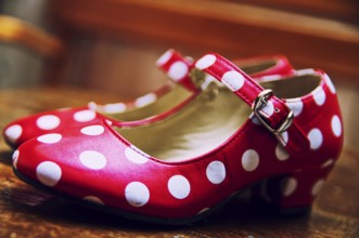 Red dance shoes with white dots