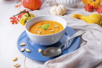 Healthy pumpkin soup with ginger, carrots and coconut milk