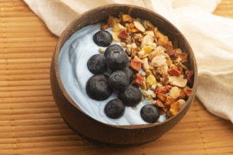 Healthy breakfast concept with flakes, blue spirulina and fresh berries