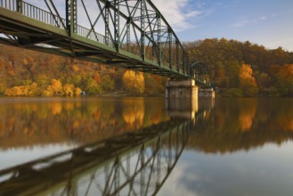 Footbridge over the Vltava river in Davle in Czech Republic. Autumn scenery