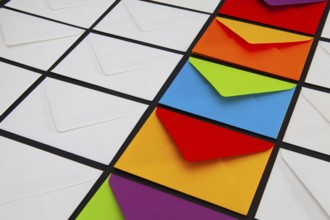 Composition with white and colored envelopes on the table. The photo suitable for various holidays
