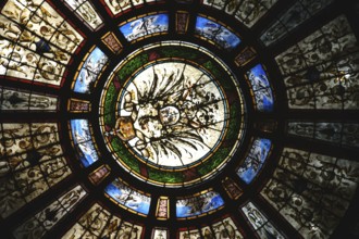 Bad Homburg, Germany - May 19, 2018: The colourful motif-painted windows of the entrance dome of