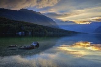 Dramatic sunset above the Bohinj Lake, Slovenia. It is located within the Bohinj Valley of the