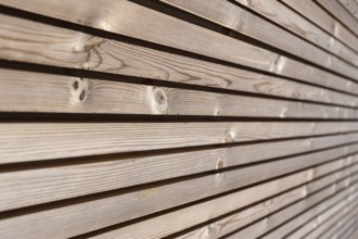 Close up of Wood paneling background texture. Modern ecological wooden facade thermal insulation