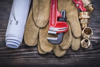 Protective gloves monkey wrench construction drawings brass plumbing fittings gate valve on wooden