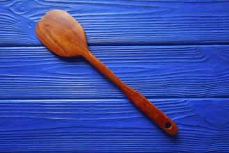 Chef tool spatula on a blue wooden background