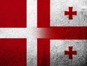 The Kingdom of Denmark National flag with flag of the country of Georgia. Grunge Background