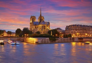 Notre Dame cathedral in Paris sunset from Seine river in France