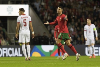 Football match, captain Cristiano RONALDO CR7 Portugal centre with both arms pointing upwards not