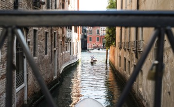 Man on a boat in Venice. Pass thru the channel