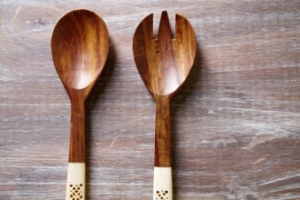 Wood spoon and fork on wooden board kitchen tools