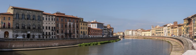 Old picturesque houses at the Arno river waterfront in Pisa, Italy, Europe