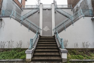 Belgium, 03 15 2019: The symmetric diagonal staircase of the dead end Auguste Snieder street with a