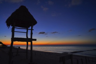 Holbox island sunset beach tropical hut in Mexico
