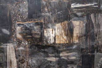 An abstract composition with dark and rugged natural textures, stone, natural stone, stone